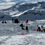Vecinos de Licanten vivieron inolvidable jornada en la nieve gracias al programa Turismo en Vacaciones