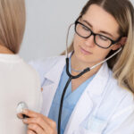 side view doctor with stethoscope 750x400 1